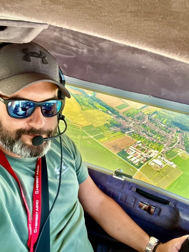 Jiří Koutný flying a light aircraft